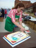 Kathryn Paton of the Northern Territories Federation of Labour cuts the first cake.