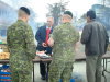Mp Dennis Bevington chats with members of Joint Task Force North and GNWT Environment and Natural Resources Assistant Deputy Minister Ernie Campbell.