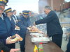 MP Bevington serves up hot dogs and hamburgers to hungry RCMP officers.