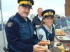 RCMP officers enjoy hamburgers and hot dogs.
