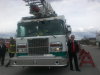 MP Dennis Bevington used the Yellowknife Fire Department's fire truck speakerphone to address the crowd. At the left of the truck is Fire Chief Albert Hedrick and Lieut. Mike Lowing.