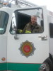 Lieut. Mike Lowing climbs into his fire truck.