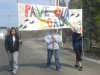 Ndilo students marched with a sign demanding their roads be paved.