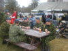 Members of Joint Task Force North and other Protective Services Agencies eat and socialize on the lawn of Yellowknife City Hall