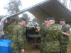 Members of Joint Task Force North and other Protective Services Agencies eat and socialize on the lawn of Yellowknife City Hall