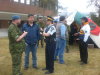 RCMP officers mingle at their information booth, which was set up during the BBQ.
