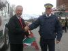 MP Dennis Bevington hands a Certificate of Appreciation to RCMP Chief Superintendent Tom Middleton.
