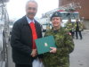 MP Dennis Bevington hands a Certificate of Appreciation to Brigadier General Chris Whitecross, Joint Task Force North.
