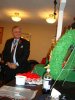 NWT Commissioner George Tuccaro places poppy on cross during The Royal Canadian Legion's Role Call Ceremony.