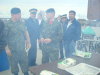 RCMP officers and JTFN members wait in the line up for food.