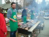 Yellowknife Deputy Mayor Mark Heyck, and Dave Grundy and Amy Doerksen of the Workers Safety and Compensation Commission cook the burgers and hot dogs.