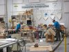 Carpentry competitors making dog houses