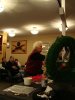 Long-time Yellowknifer Mrs. Esther Braden places a poppy on the cross of remembrance.