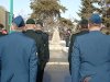 JTFN Members standing at attention in front of the cenotaph.